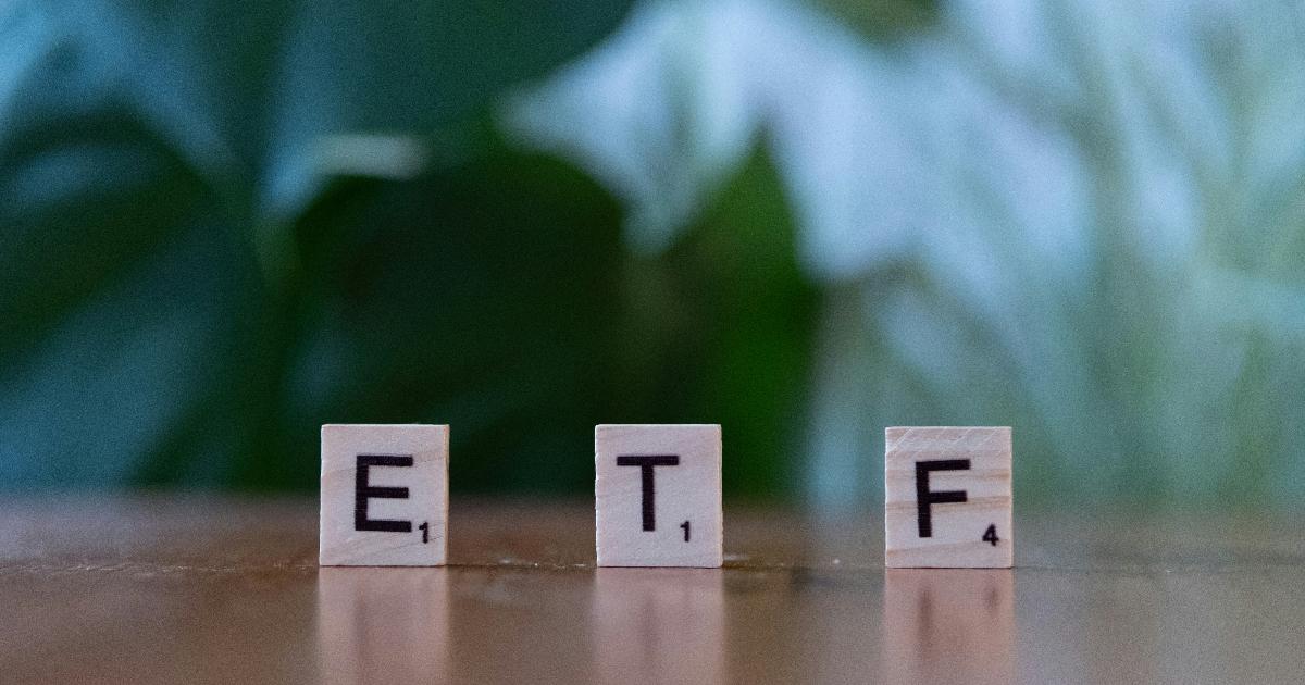 A factor-tilted all-in-one ETF compared with a plain market-cap ETF on a desk, illustrating the focus_keyword of factor investing choices