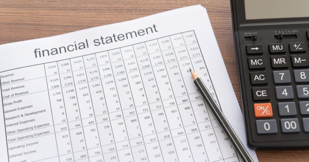 A calculator beside investment statements illustrates how the expense ratio reduces long-term portfolio growth