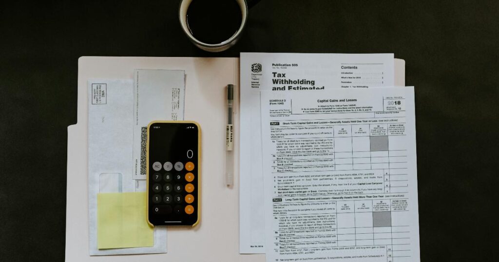 A surviving spouse reviewing retirement paperwork, illustrating the widow's penalty and higher taxes after a household changes size