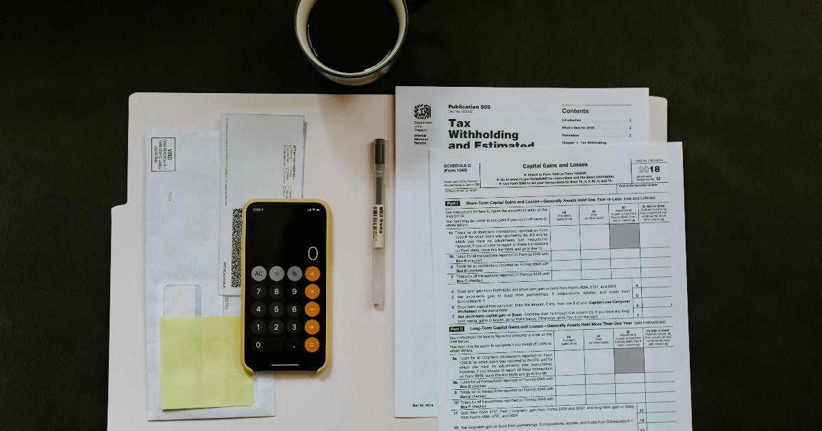 A surviving spouse reviewing retirement paperwork, illustrating the widow's penalty and higher taxes after a household changes size